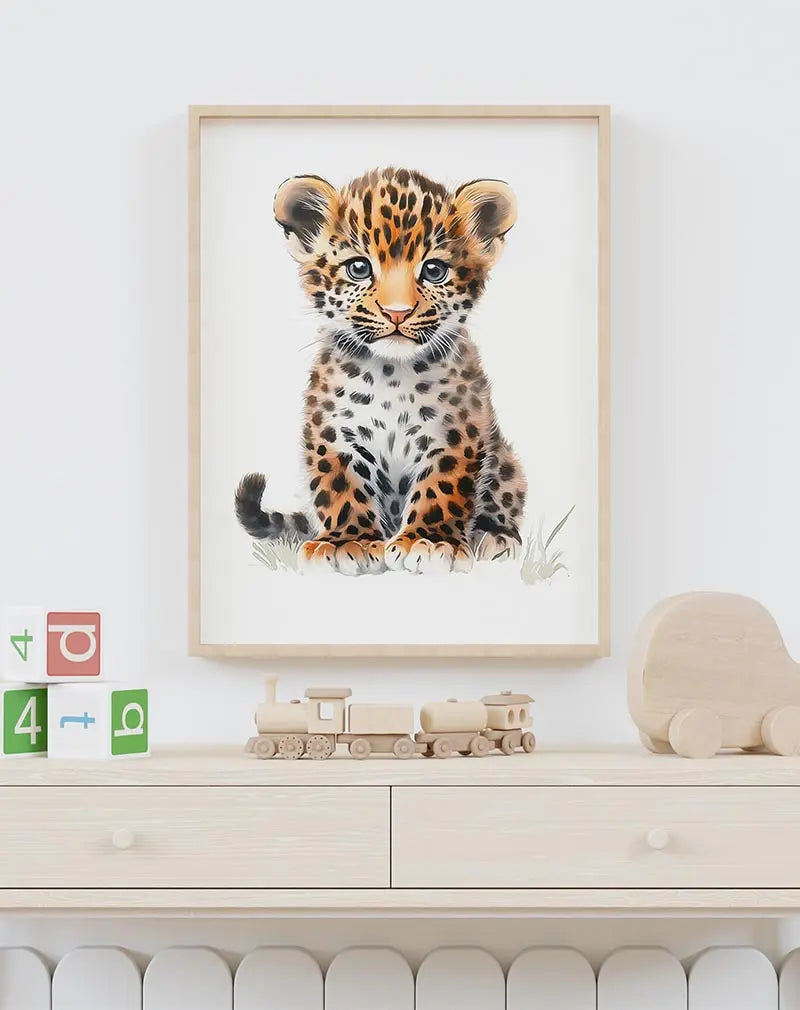 A cute illustration of a baby leopard cub with big blue eyes and spotted fur, perfect wall art for kids' rooms or animal lovers.