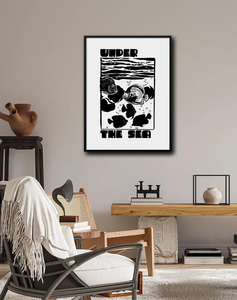 Black and white illustration of fish swimming under the sea with the text "Under the Sea," ideal for aquatic-themed or minimalist decor