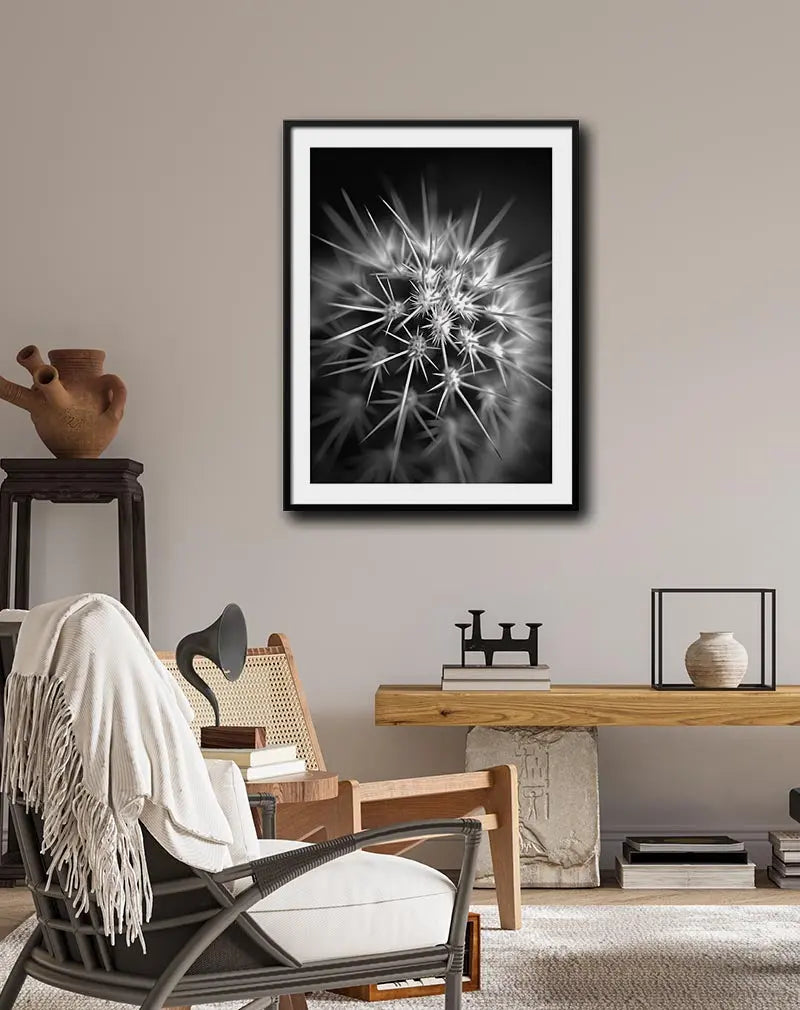 Black and white close-up photography of a cactus with sharp spines, creating a striking contrast and modern aesthetic. This cactus wall art poster adds a minimalistic yet bold touch to any space, perfect for nature and monochrome lovers