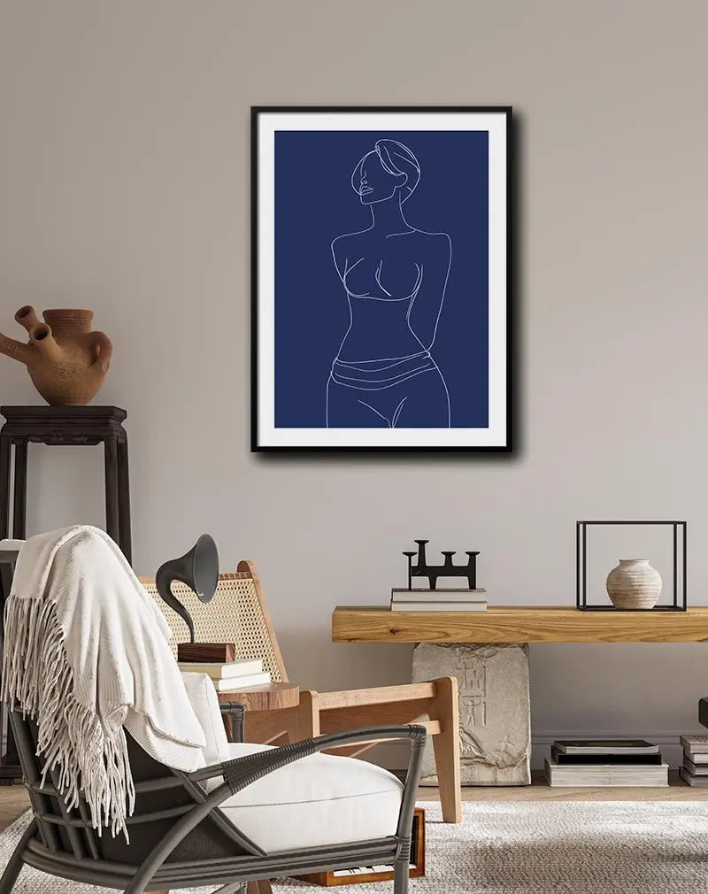 A minimalist line art illustration poster of a female figure on a deep blue background. The simple white line work captures the elegance of the form, making this wall art illustration perfect for modern and stylish decor