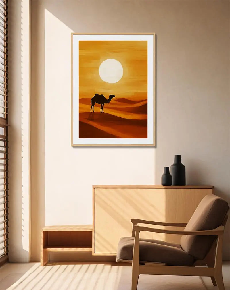 A silhouette of a camel standing against a desert sunset, with soft orange dunes and a bright sun dominating the horizon. Perfect wall art for adding a serene and warm atmosphere to any space