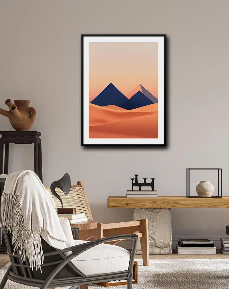 A minimalist geometric design of pyramids in a desert at sunset. Perfect wall art for a modern and tranquil atmosphere