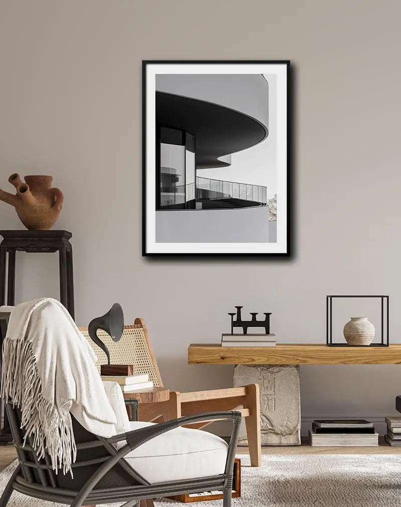 A minimalist illustration of modern architecture with sleek curves and glass railings. The design emphasizes clean lines and a monochromatic palette, making it a sophisticated piece of wall art. Perfect for contemporary interiors seeking an architectural touch