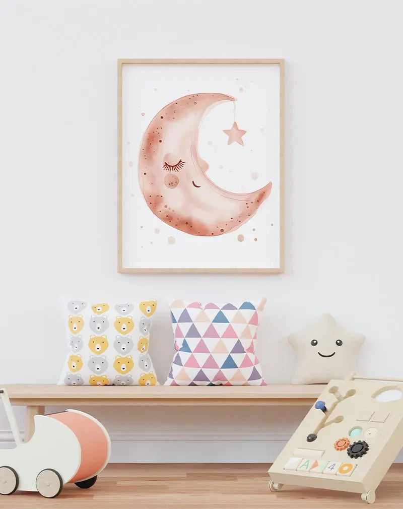 A delightful illustration of a smiling moon with soft pink hues, gently holding a dangling star. This charming wall art is perfect for creating a dreamy and soothing atmosphere in a nursery or bedroom