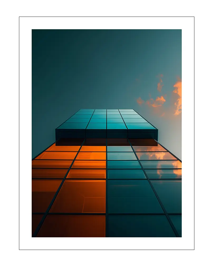 A striking perspective of a modern glass building reflecting the sky with a mix of orange and blue tones. Perfect wall art for contemporary spaces, adding a sleek and architectural touch to your decor