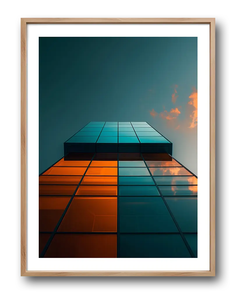 A striking perspective of a modern glass building reflecting the sky with a mix of orange and blue tones. Perfect wall art for contemporary spaces, adding a sleek and architectural touch to your decor