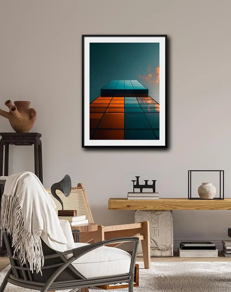 A striking perspective of a modern glass building reflecting the sky with a mix of orange and blue tones. Perfect wall art for contemporary spaces, adding a sleek and architectural touch to your decor