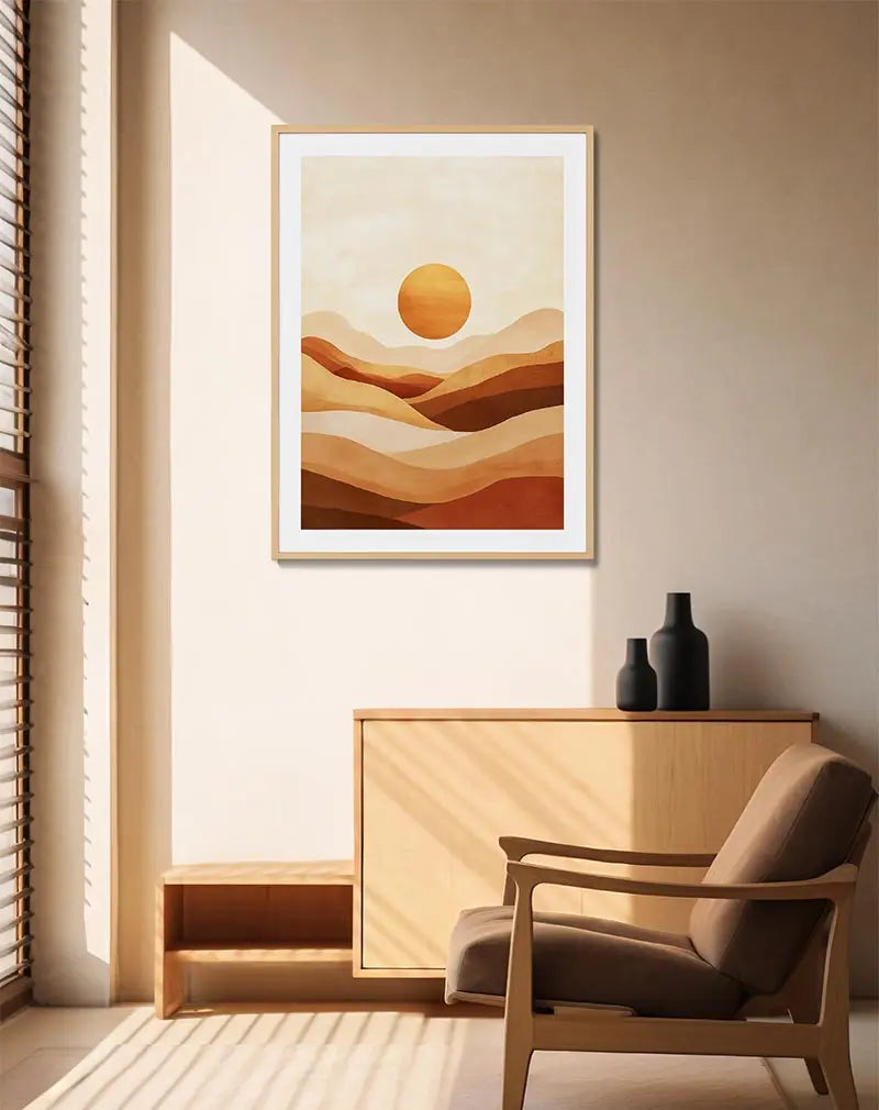 A warm-toned abstract illustration of a sunset over desert hills. Perfect wall art for bringing a calming and earthy vibe to any room with its soothing gradient of orange and beige hues