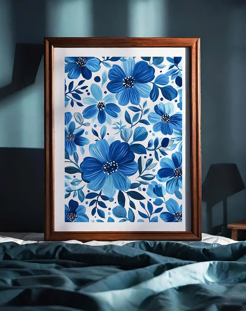 A charming illustration of blue flowers in a decorative pattern, with various shades of blue leaves and blossoms. Perfect wall art or poster for adding a calm and fresh botanical touch to your space