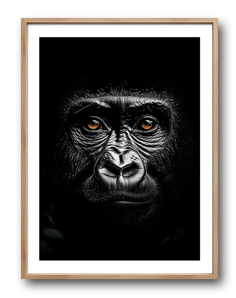 A mesmerizing black and white portrait of a gorilla with piercing orange eyes, emphasizing its powerful expression and intricate fur details.