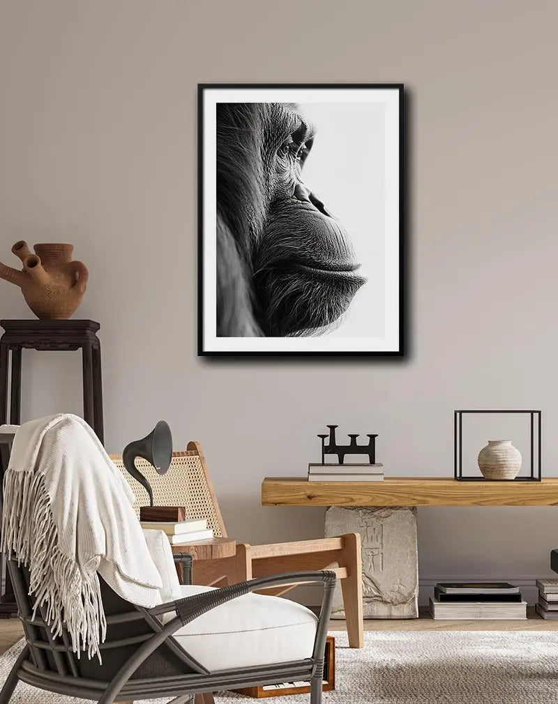 A detailed black and white illustration of an orangutan in a contemplative pose. Perfect wall art for animal lovers, bringing a sense of wisdom and serenity into any space