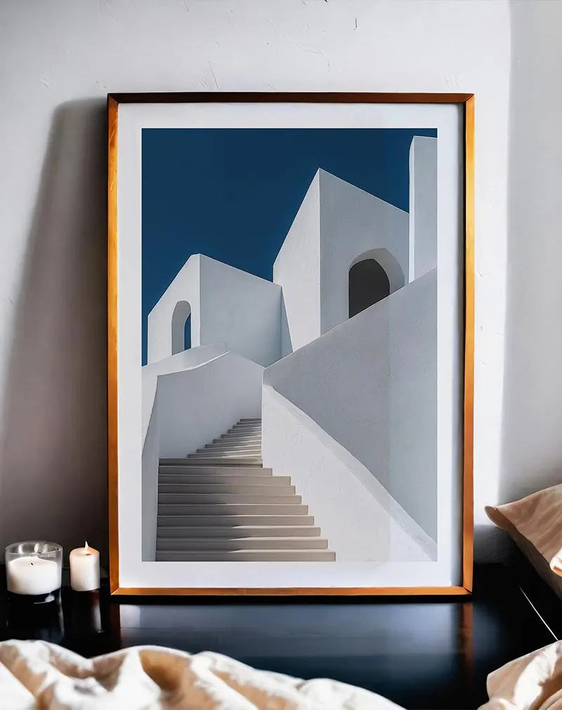 A modern poster showcasing white architectural structures with a minimalist staircase against a deep blue sky.