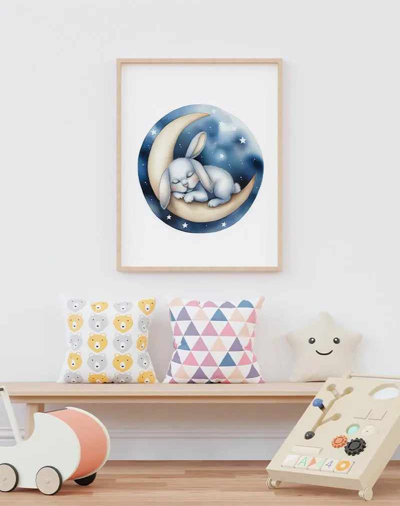 A sweet illustration of a bunny sleeping on a crescent moon with a starry night sky. Perfect wall art for a nursery or children's room, creating a calming and magical atmosphere for peaceful sleep