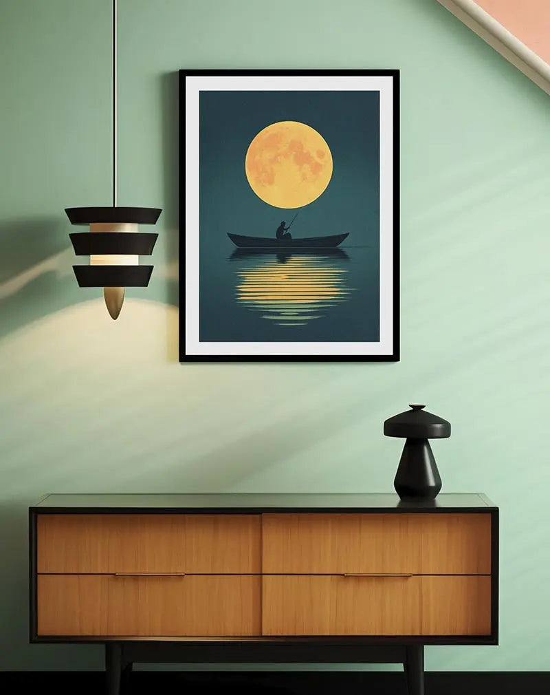 A peaceful illustration of a person fishing under a large glowing moon. The reflection of the moon in the water creates a calming effect. Perfect wall art for adding a tranquil and serene atmosphere to any room