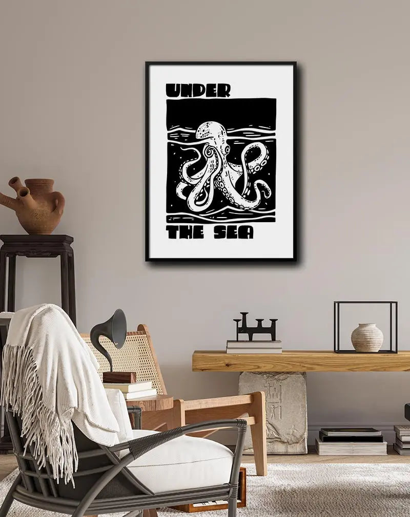 A bold black-and-white illustration of an octopus with the words "Under the Sea" framing the artwork. Perfect wall art for adding a touch of adventure and marine life to any space, ideal for ocean-themed rooms or creative areas