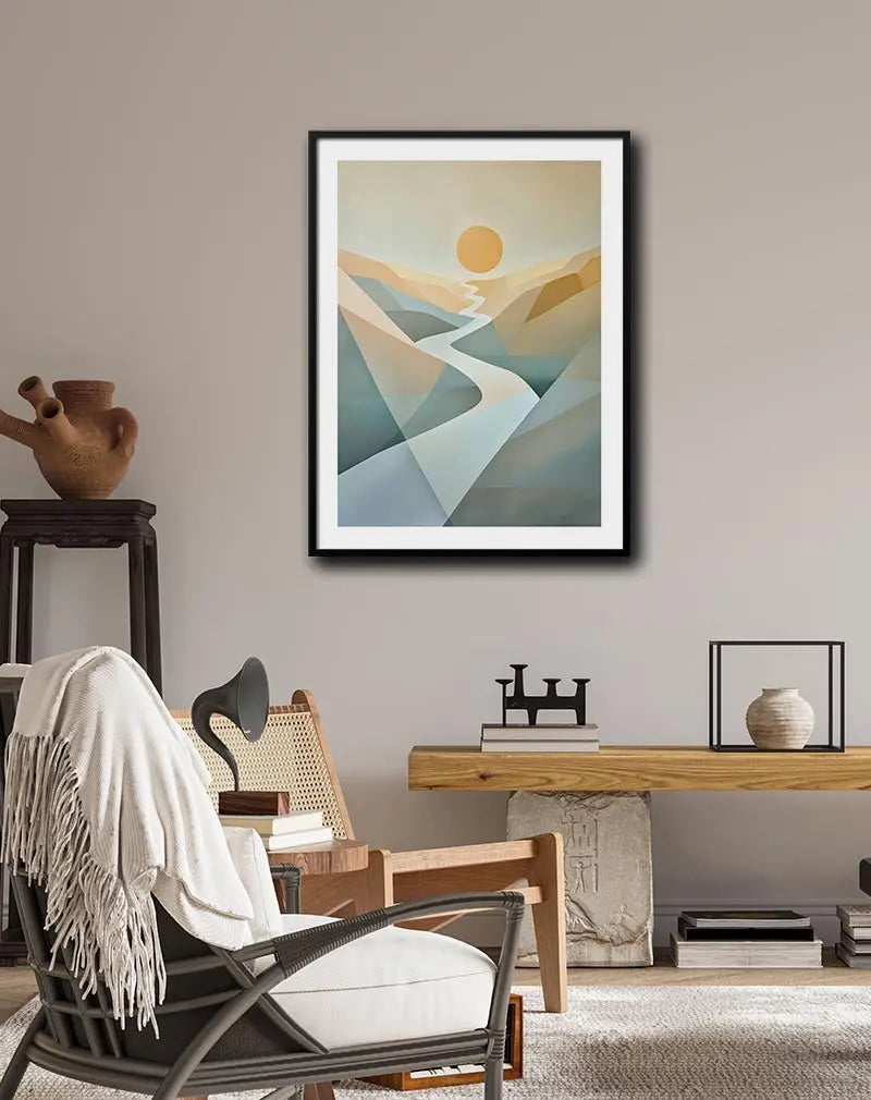 An abstract illustration of a sun rising over geometric mountains with a winding river. Perfect wall art for creating a calming and serene atmosphere in any space, great for modern or minimalist decor