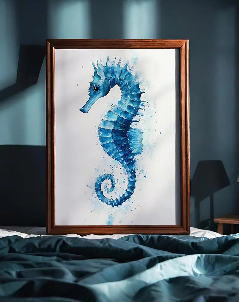 A beautiful watercolor illustration of a blue seahorse, delicately detailed with soft splashes of water. This aquatic-inspired wall art brings a serene and calming feel, perfect for adding a touch of the ocean to any room. Perfect wall art for coastal-themed decor or nature lovers