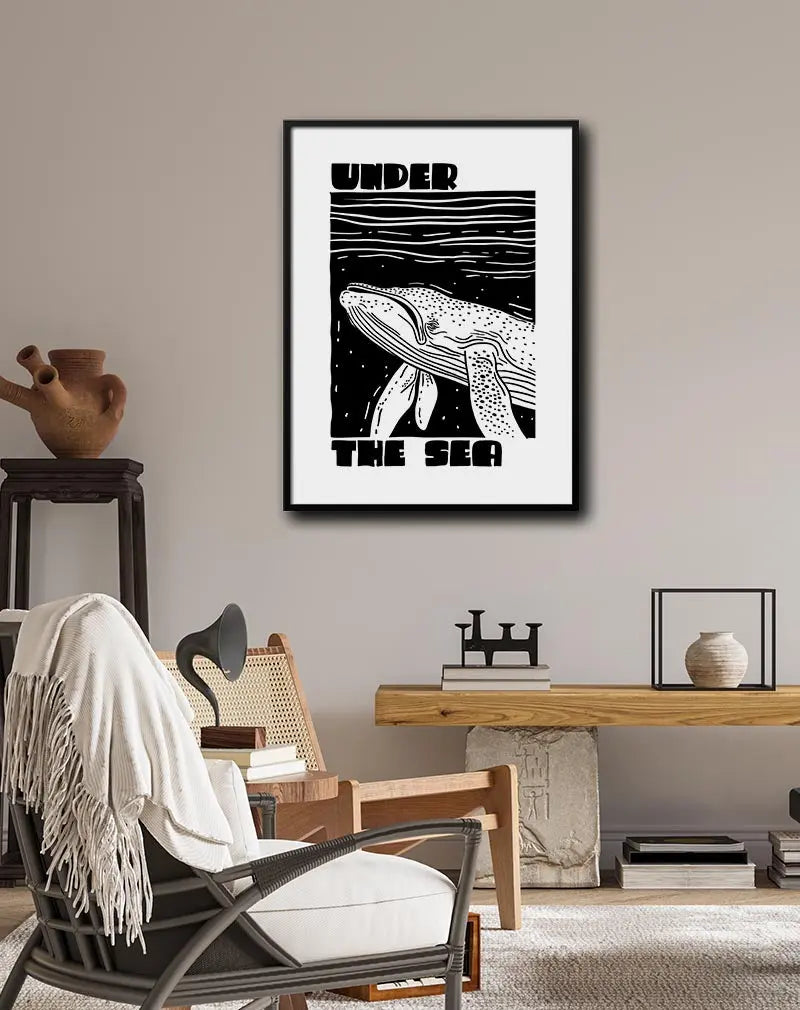 A black and white illustration of a whale with the text "Under the Sea". Perfect wall art for ocean lovers, adding a nautical and artistic touch to any room