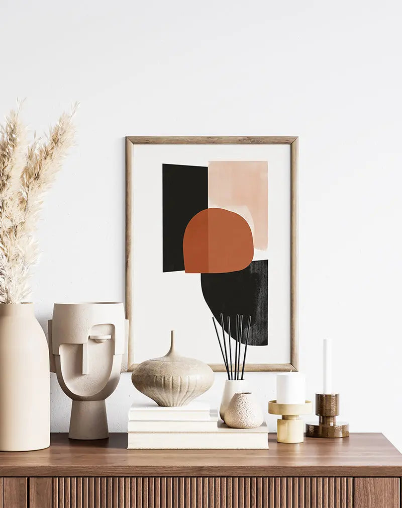 A geometric abstract illustration with bold shapes in earthy tones of terracotta, black, and beige.