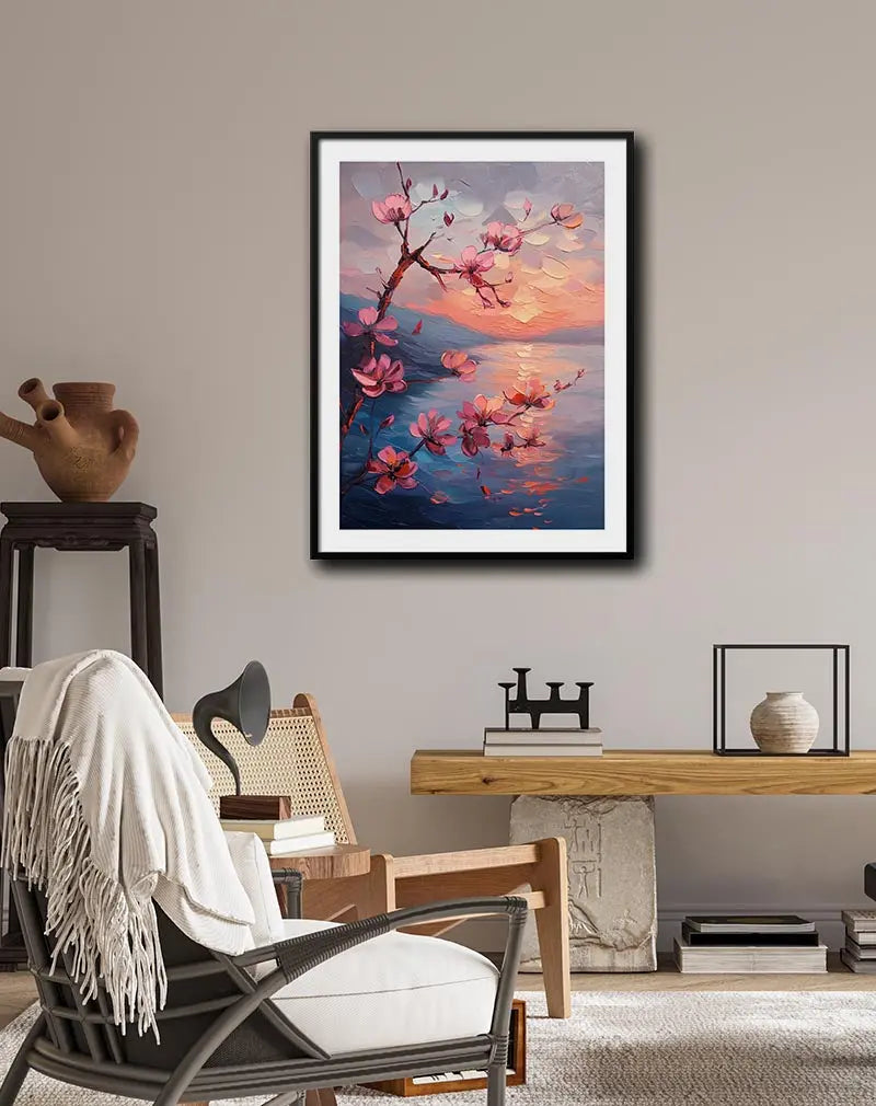 A vibrant painting of cherry blossom branches set against a glowing sunset reflected on a serene body of water. Perfect wall art for adding warmth and tranquility to any living space