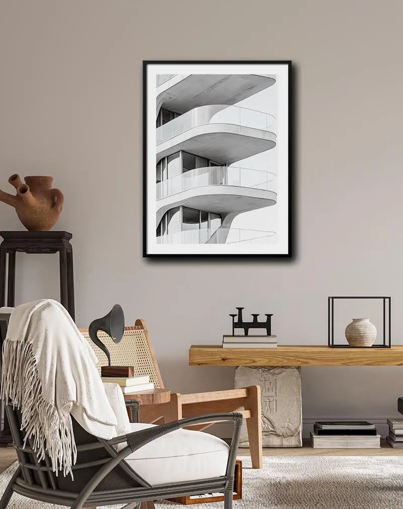 A sleek and minimalist photograph of modern architectural balconies with curved lines and glass railings. Perfect wall art for a contemporary space, bringing an elegant, urban vibe